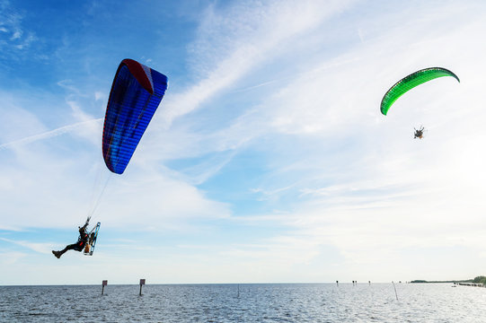 man ride Paramotor flying in the sky
