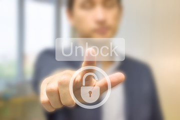 Business man pressing security code on virtual unlock key