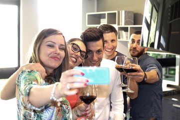 Group of friends make a selfie with mobile phone