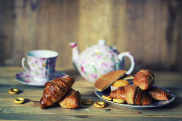 tea cup croissant breakfast