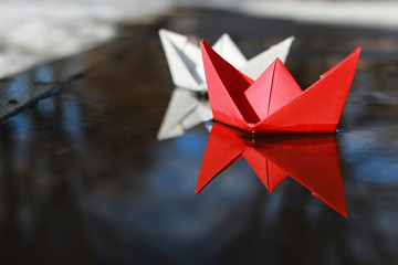 paper boat in a pool