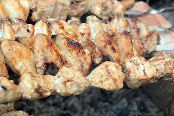Chicken on the grill to cook