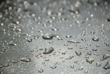 Water drops on metal surface. Selective focus.