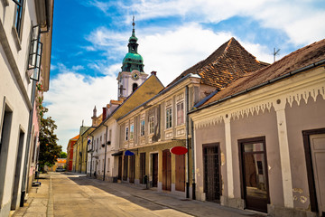 Fototapeta na wymiar Town of Karlovac street and church