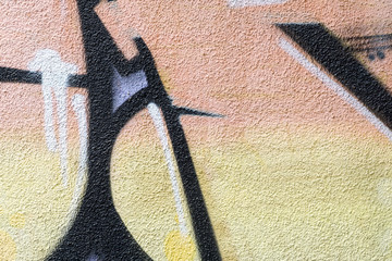 Detail of a graffiti art on a wall. Wall painted in different colors. Abstract colorful background. © msnobody