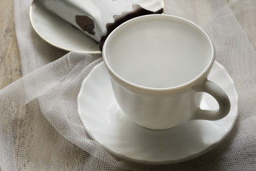 Cup on the table and cake