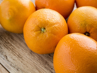 oranges on wooden background.