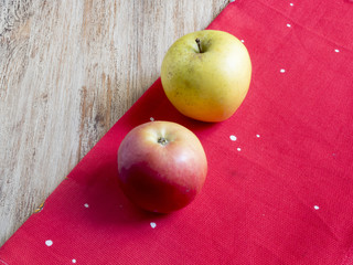 apples on a red cloth