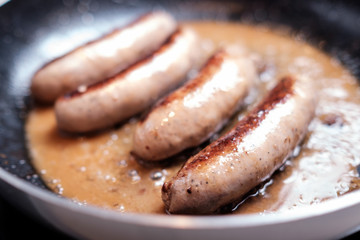 Sausages cooking