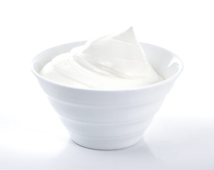 Bowl of cream on white background