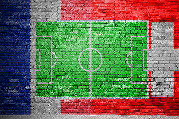 Ziegelsteinmauer Frankreich vs. Schweiz Fußballfeld Graffiti