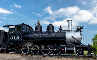 Fototapeta na wymiar Steel black train engine on tracks