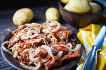 Marinated with onion pork ribs and raw potatoes