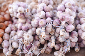 Closeup on garlic in sacks at market