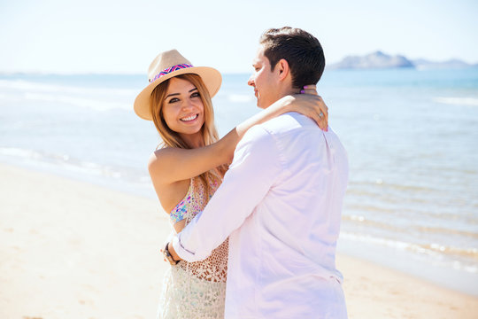 Beautiful woman with her boyfriend at the beach