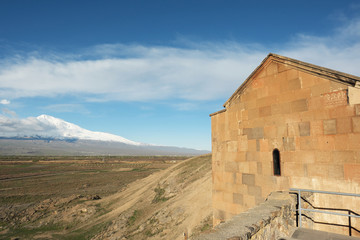 Fototapeta na wymiar Ancient monastery in front of mountain