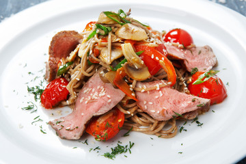 Asian food. Fried thai rice noodles with veal meat