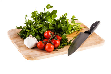 Mediterranean parsley garlic tomatoes and knife