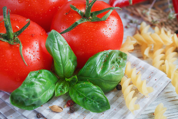 Italian food background, with tomatoes, basil, pasta, olive oil,