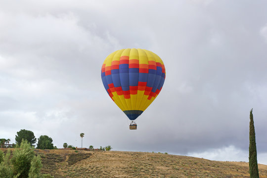 Balloon launch over hill during spring morning
