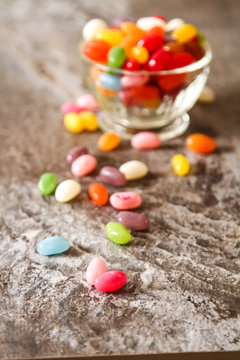 Colorful Jelly Beans on background stone