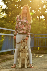 Lovely Woman Posing With a Wolf
