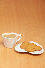 Gingerbread cookies and tea coffee on table.