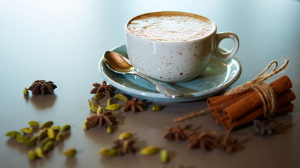 Cup of hot latte coffee on table