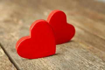 Fototapeta premium Wooden hearts on rustic wooden background