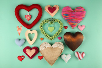 Fototapeta premium Valentine's Day concept. Handmade hearts on turquoise background, close up