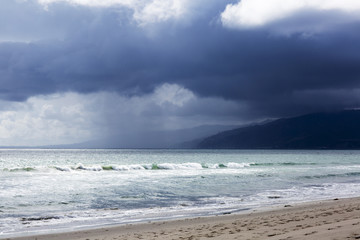 Pacific ocean during a storm. Beach landscape in the U.S. in bad weather. The ocean and waves during strong winds in United States, Santa Monica.