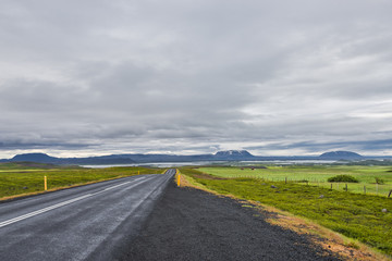 Isolated road and Icelandic colorful landscape on Iceland, summe
