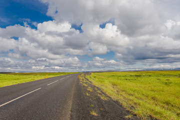 Fototapeta na wymiar Isolated road and Icelandic colorful landscape on Iceland, summe