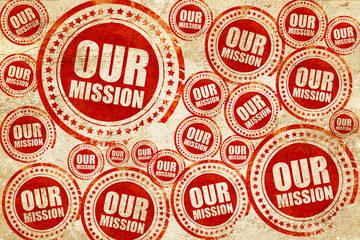Obraz premium our mission, red stamp on a grunge paper texture