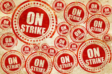 on strike, red stamp on a grunge paper texture