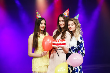 Happy birthday! Group of smiling friends gathered together with