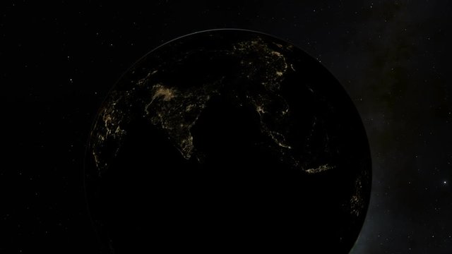 A sunrise over the edge of planet Earth featuring the South East Asia subcontinent illuminated by artificial light
