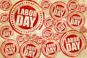 labor day, red stamp on a grunge paper texture