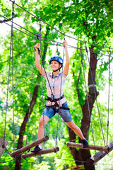 adventure climbing high wire park - people on course in mountain