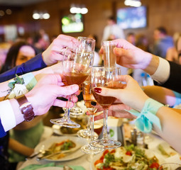 Holiday Event people cheering each other with champagne.