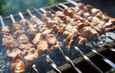 Cooking meat on the fire.