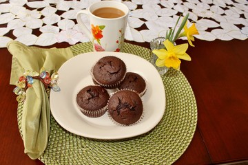 Chocolate muffins and a cup of coffee