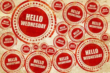 hello wednesday, red stamp on a grunge paper texture