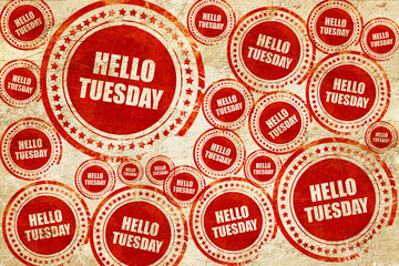 hello tuesday, red stamp on a grunge paper texture
