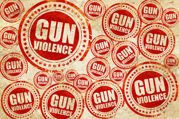 gun violence, red stamp on a grunge paper texture