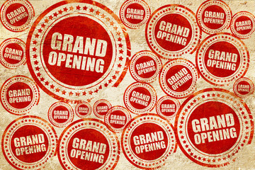 grand opening, red stamp on a grunge paper texture