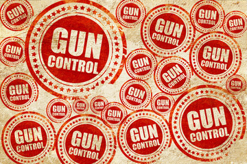 Fototapeta premium gun control, red stamp on a grunge paper texture