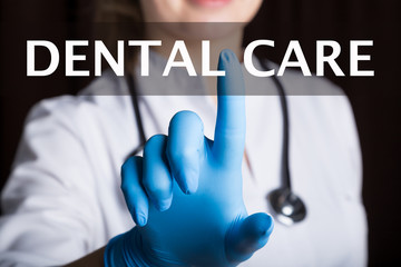 technology, internet and networking in medicine concept - medical doctor presses dental care button...