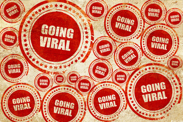 going viral, red stamp on a grunge paper texture