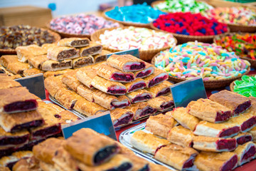 amazing variety of bakery and other colorful sweets on market stall